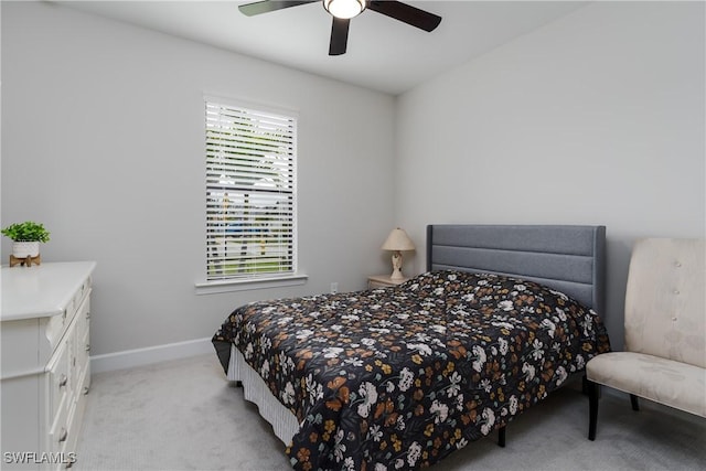 bedroom featuring ceiling fan and light carpet