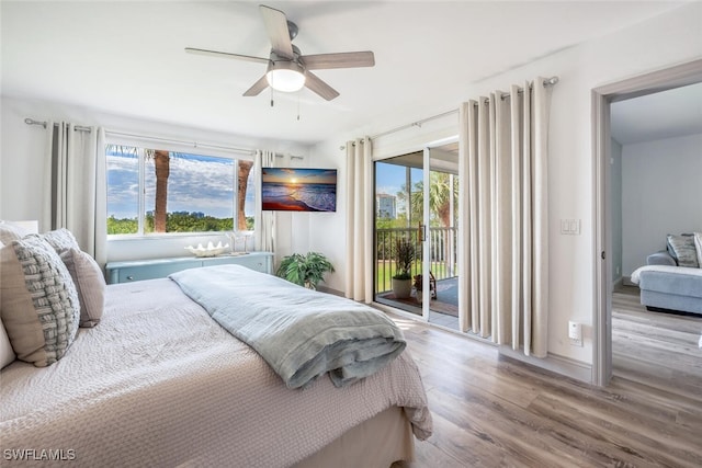 bedroom featuring ceiling fan, access to exterior, multiple windows, and light hardwood / wood-style flooring