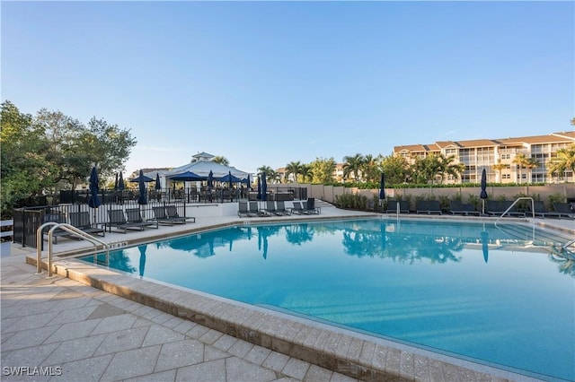 view of swimming pool featuring a gazebo and a patio area