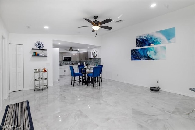 dining space with visible vents, vaulted ceiling, recessed lighting, marble finish floor, and a ceiling fan