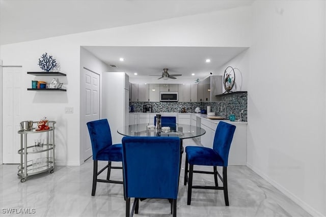 dining space featuring recessed lighting, baseboards, and a ceiling fan