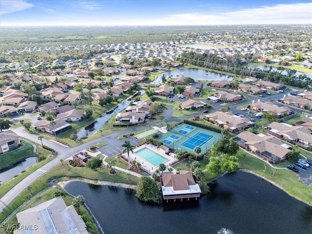 birds eye view of property featuring a water view and a residential view