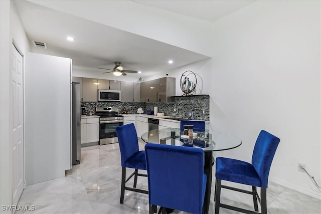 dining room with visible vents, recessed lighting, a ceiling fan, and marble finish floor