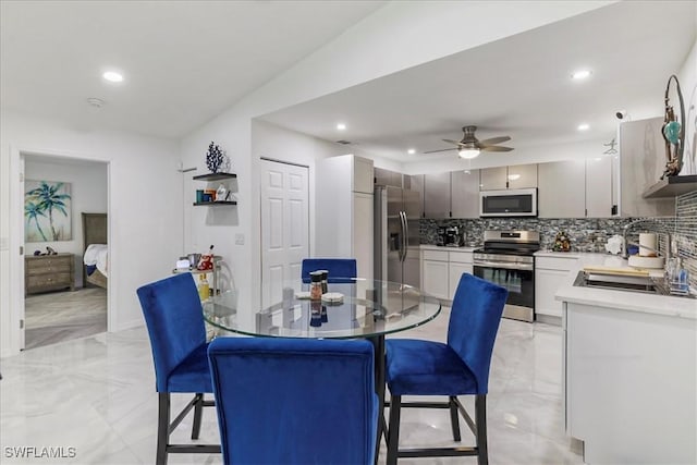 17310 Timber Oak Ln, Fort Myers, FL 33908 - dining room featuring light marble finish floors, recessed lighting, and a ceiling fan