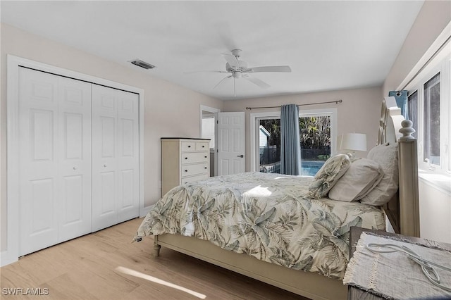 bedroom featuring ceiling fan, a closet, light hardwood / wood-style floors, and access to outside