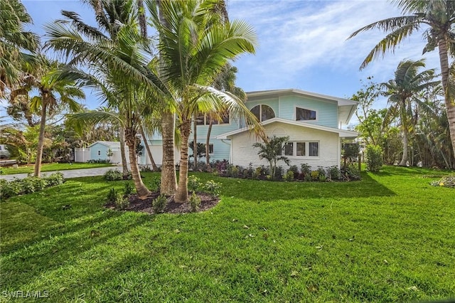 view of home's exterior featuring a lawn