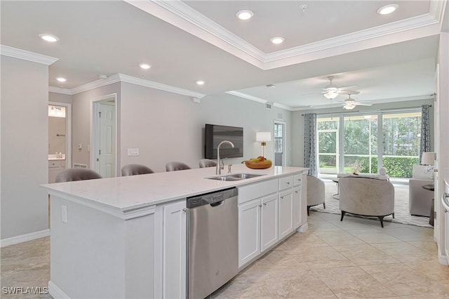 kitchen with white cabinetry, a kitchen island with sink, dishwasher, light stone countertops, and sink