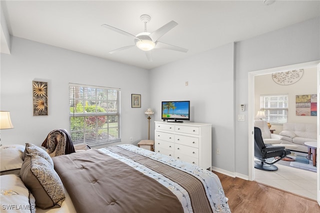 bedroom featuring ceiling fan and light hardwood / wood-style floors