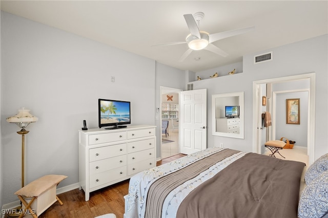 bedroom featuring ceiling fan and light hardwood / wood-style flooring