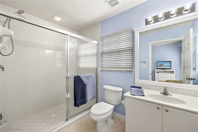 bathroom with a shower with shower door, toilet, and vanity