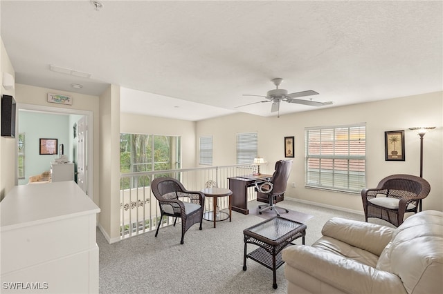 living room featuring ceiling fan and light colored carpet