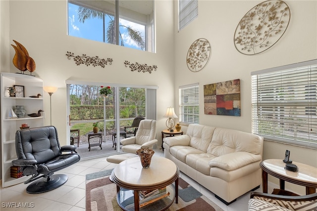 tiled living room with a towering ceiling