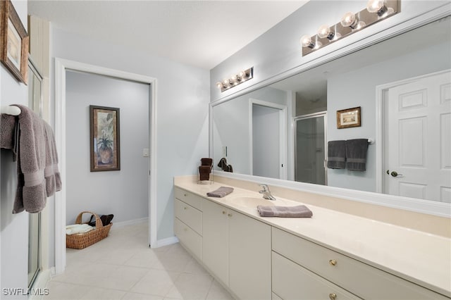 bathroom featuring a shower with shower door, tile patterned floors, and vanity