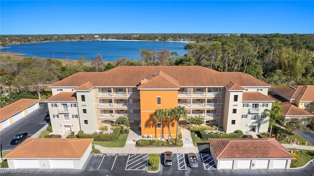 birds eye view of property featuring a water view