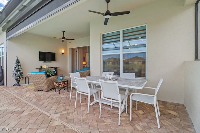 view of patio featuring ceiling fan