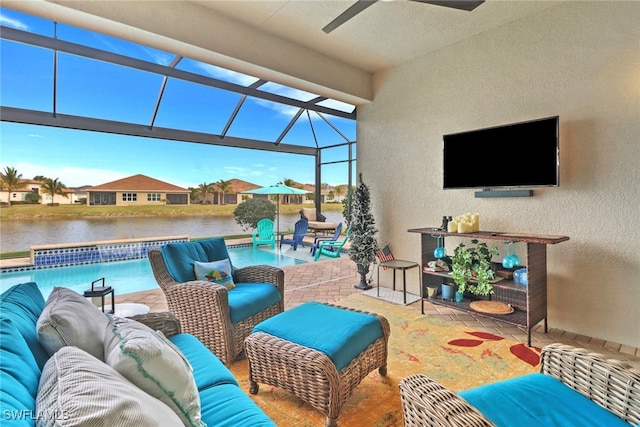 view of patio with ceiling fan, outdoor lounge area, and glass enclosure