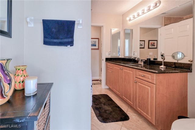 bathroom featuring tile patterned floors and vanity