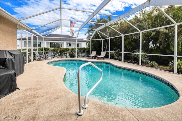 view of swimming pool featuring a lanai, grilling area, and a patio