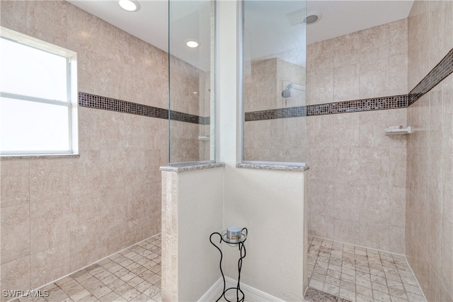 bathroom featuring tiled shower