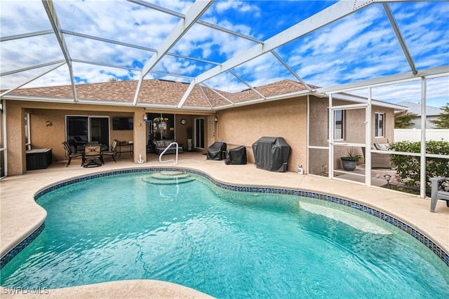 view of pool featuring a lanai and a patio area