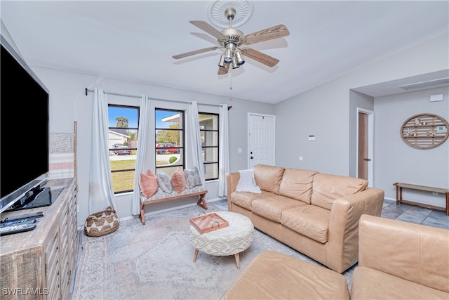 living room with ceiling fan and lofted ceiling