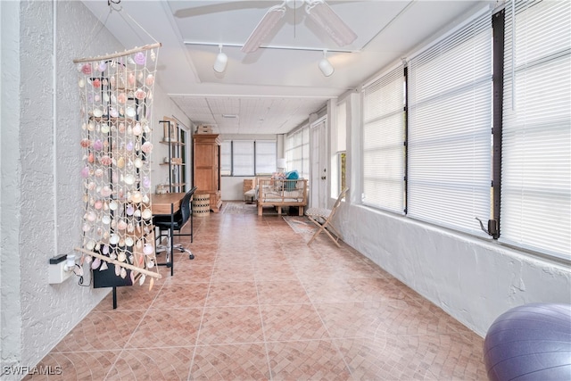 sunroom with rail lighting and ceiling fan