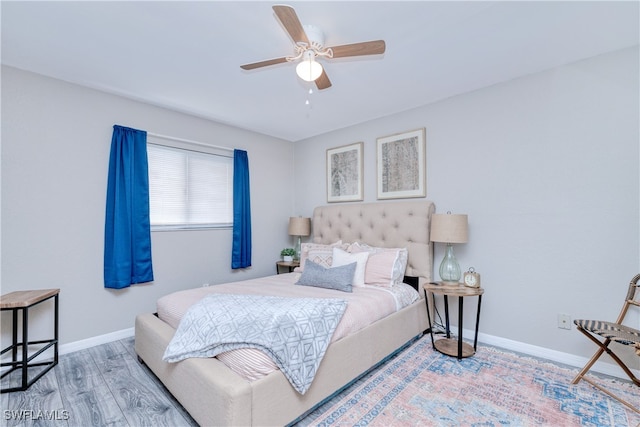 bedroom featuring hardwood / wood-style floors and ceiling fan