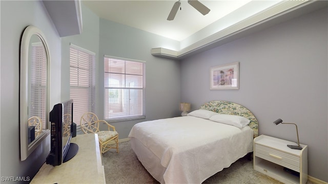 bedroom with ceiling fan and carpet flooring