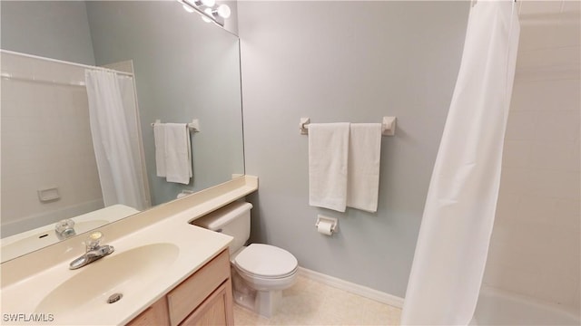 bathroom with toilet, tile patterned floors, and vanity