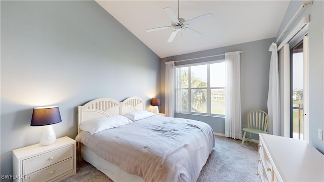 carpeted bedroom with ceiling fan and lofted ceiling