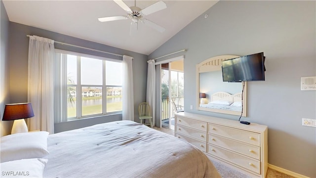 carpeted bedroom featuring ceiling fan, vaulted ceiling, and access to exterior