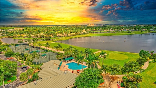 aerial view at dusk with a water view