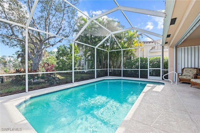 view of pool featuring a lanai and a patio area