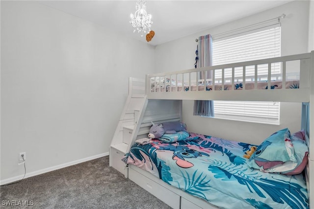 bedroom with carpet flooring and a chandelier