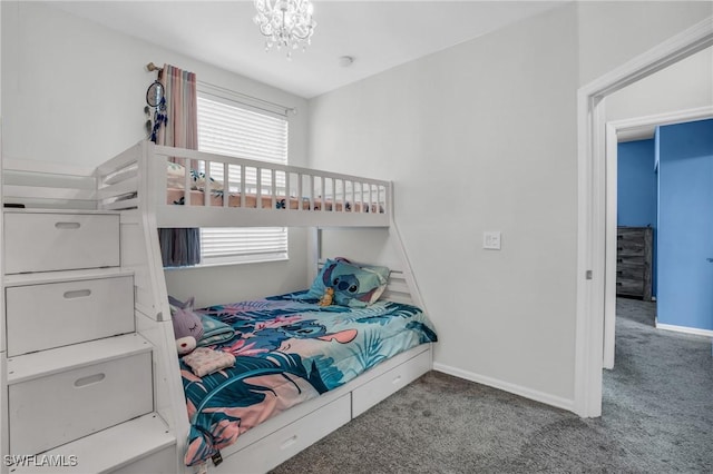 bedroom with carpet flooring and an inviting chandelier