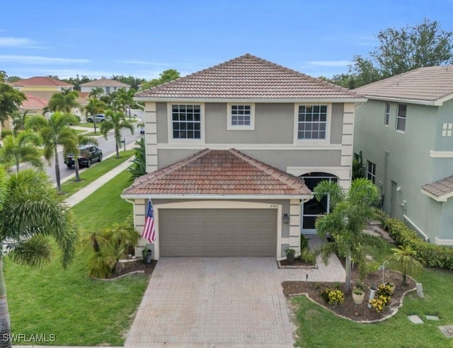 view of front of house with a garage and a front yard