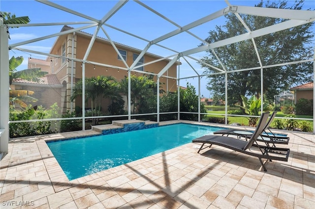 view of pool with a lanai and a patio