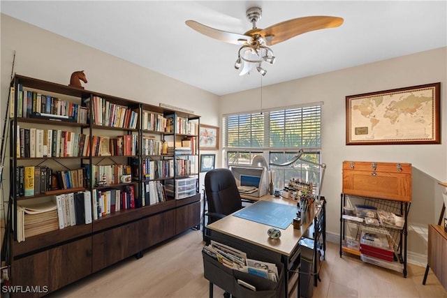 office space with light hardwood / wood-style flooring and ceiling fan