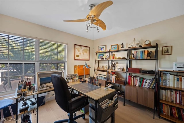 office area featuring light hardwood / wood-style floors and ceiling fan