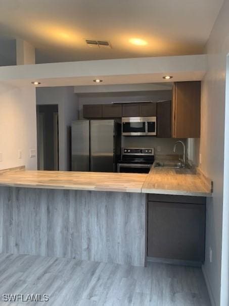 kitchen with sink and appliances with stainless steel finishes