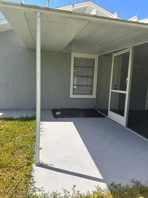 property entrance with a patio