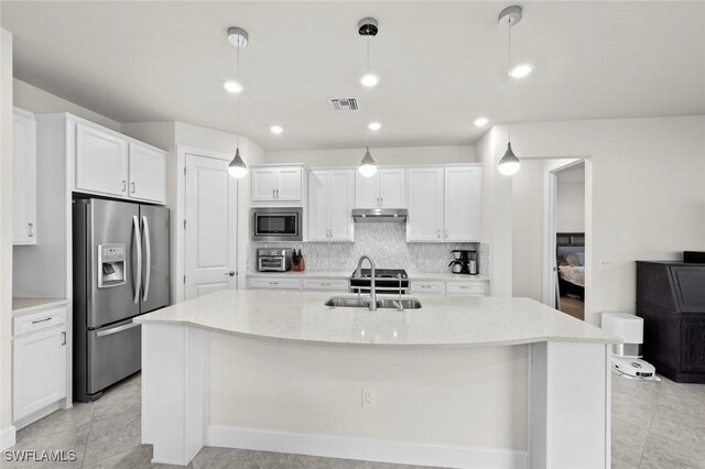 kitchen with white cabinetry, sink, stainless steel appliances, and pendant lighting