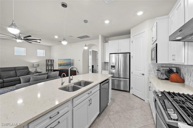 kitchen featuring white cabinets, sink, and stainless steel appliances