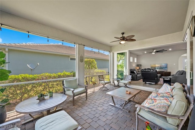 sunroom / solarium with ceiling fan