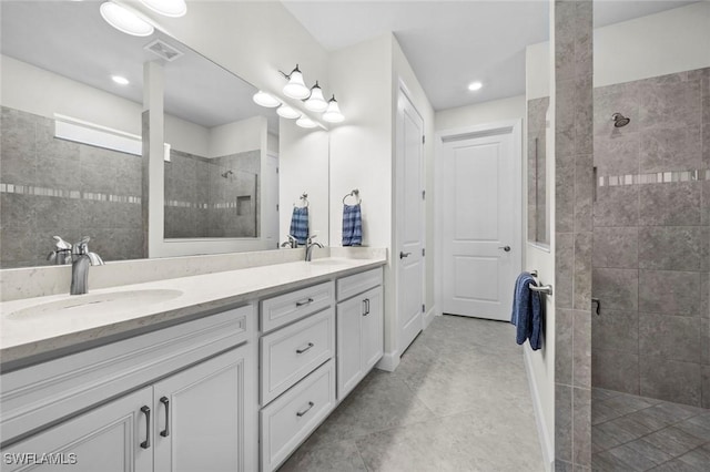 bathroom featuring vanity and a tile shower