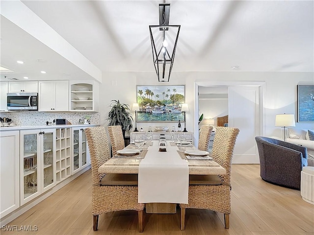 dining area with light hardwood / wood-style flooring