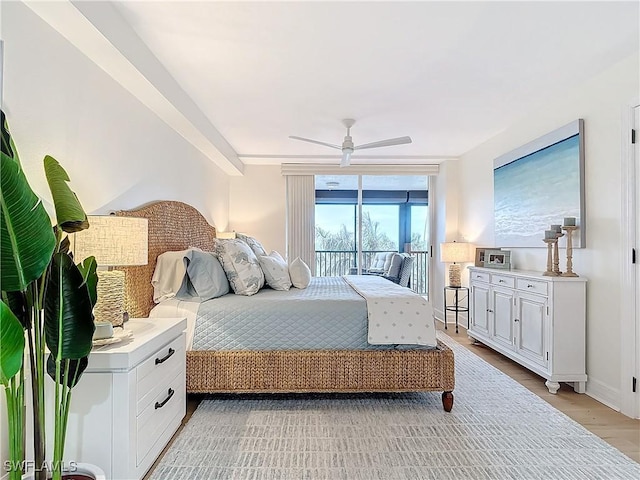 bedroom with access to outside, floor to ceiling windows, ceiling fan, and light wood-type flooring