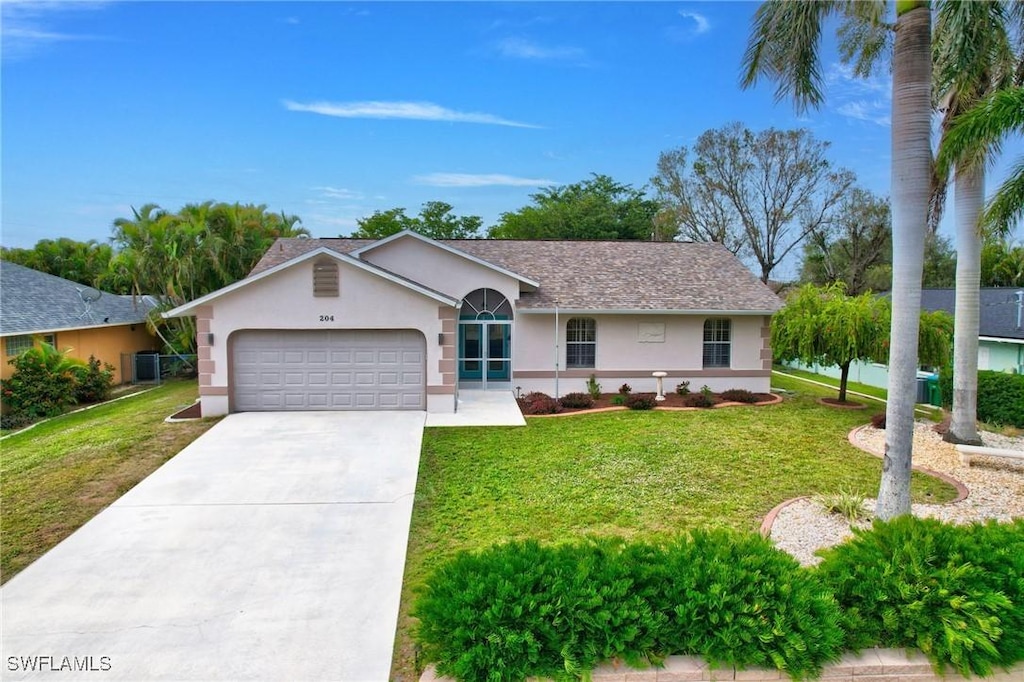 ranch-style home featuring a garage, a front lawn, and central air condition unit