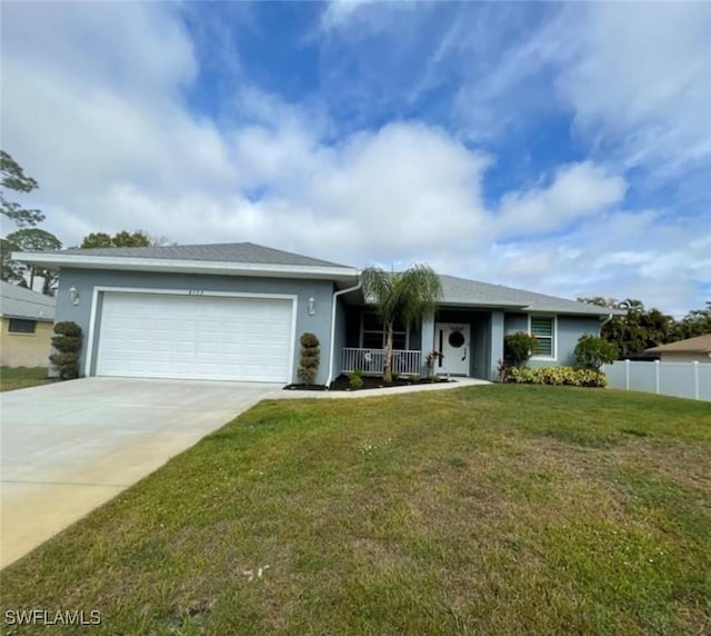 single story home with a front lawn, covered porch, and a garage