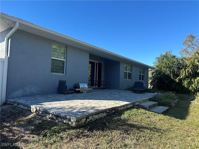 rear view of house featuring a patio area